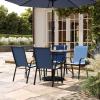 Flash Furniture Brazos Commercial Outdoor Dining Set, 47″ Tempered Glass Patio Table with Umbrella Hole, 4 Stack Chairs with Flex Comfort Seats and Backs, Navy/Black(Navy)